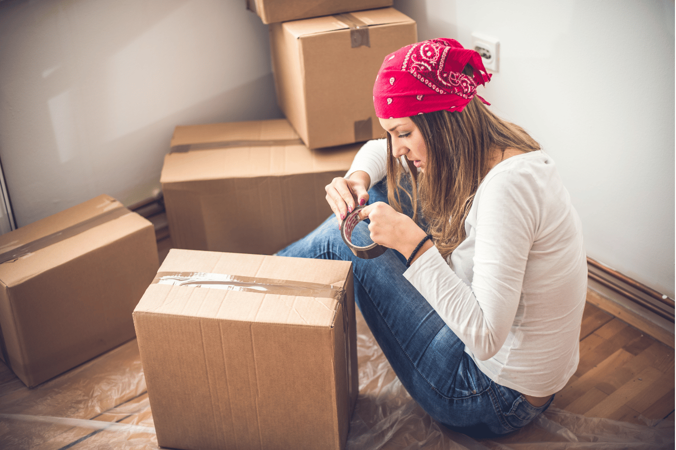 Woman packing up home assets into boxes