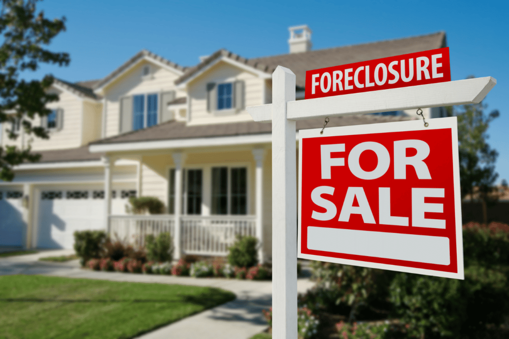 Home with foreclosure sign