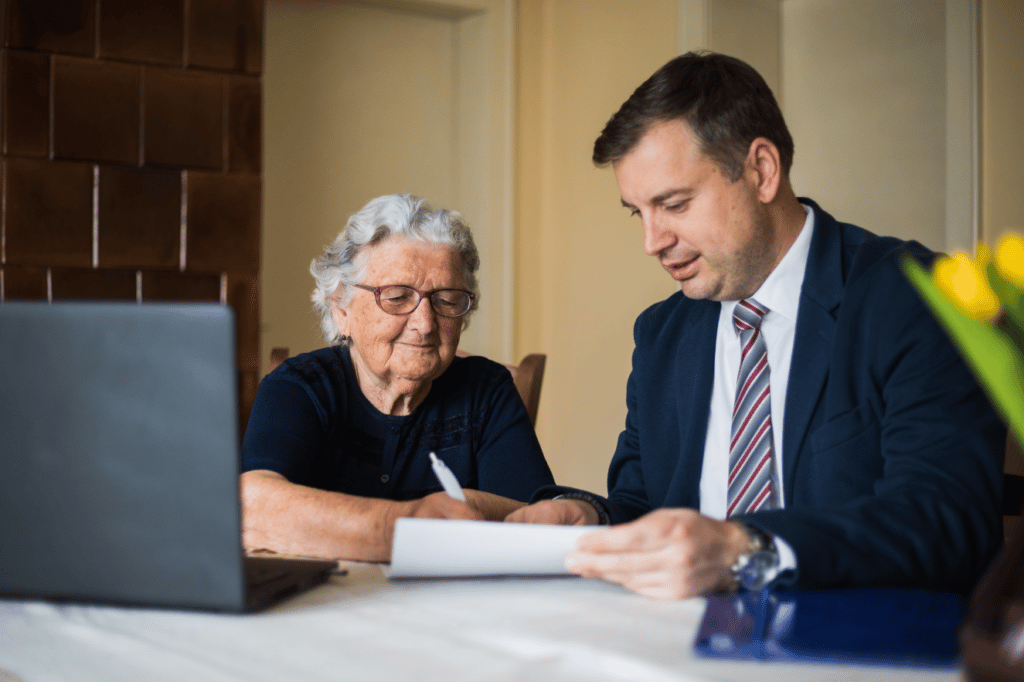 Elder woman working on last will with attorney