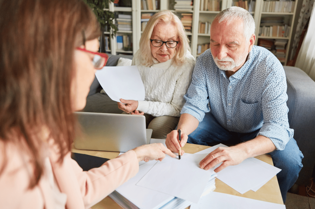Elder couple writing authorization for power of attorney