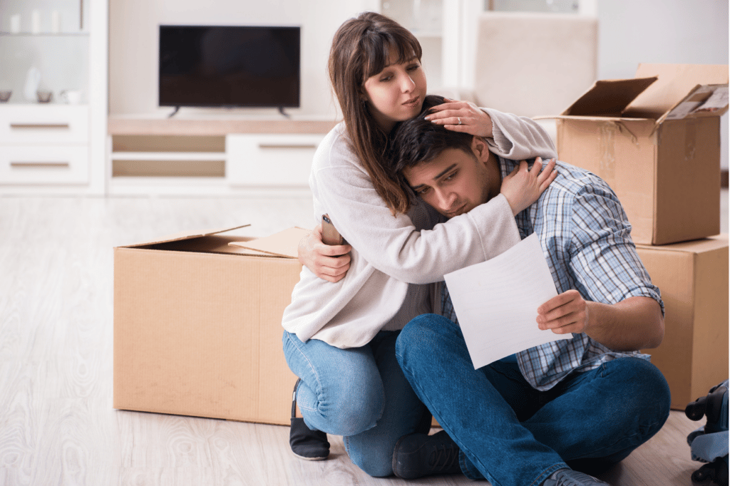 Sad couple after receiving foreclosure papers