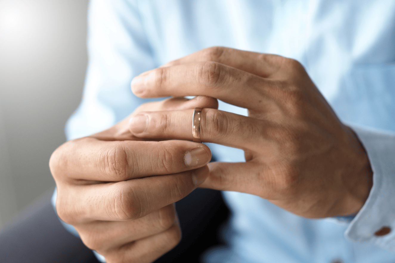 Man taking off ring after annulment