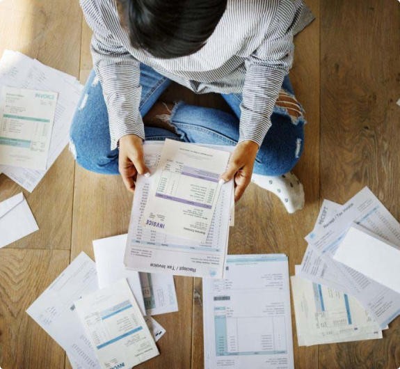 woman looking at invoices