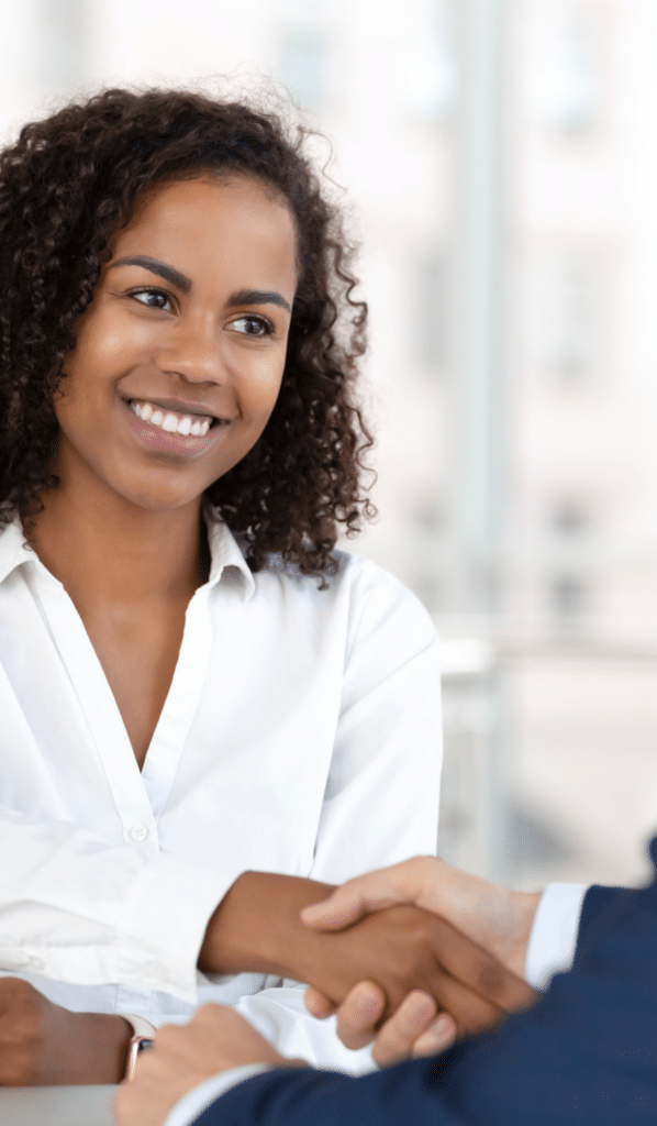 A black woman shaking a lawyer