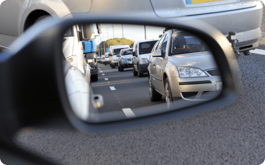 Cars seen in a passenger mirror