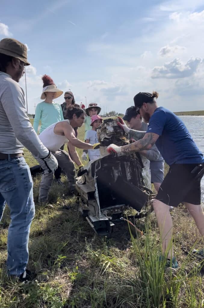 A group of people cleaning up the Everglades