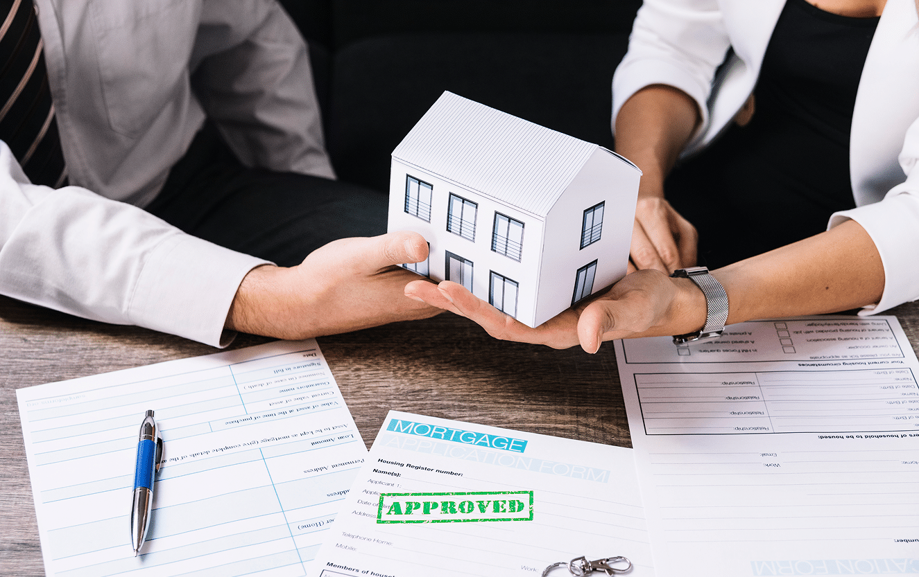 Two men reviewing legal documents for a Florida probate stay in home, holding a small wooden house model on a desk, symbolizing estate planning and property inheritance decisions.